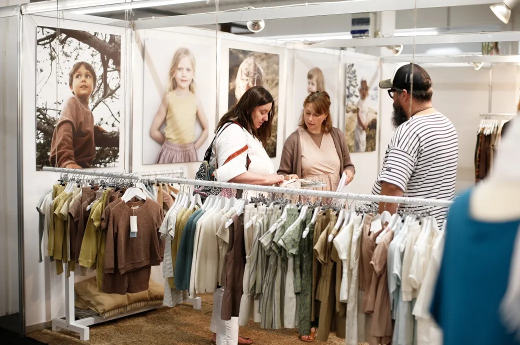 Customers enjoying Primewear's Western wear in boutique