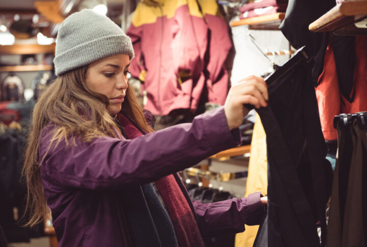 boutique owner checking style quality of western wear