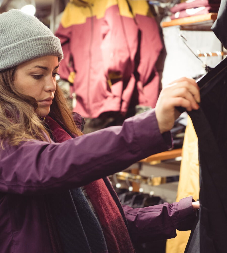 boutique owner checking style quality of western wear